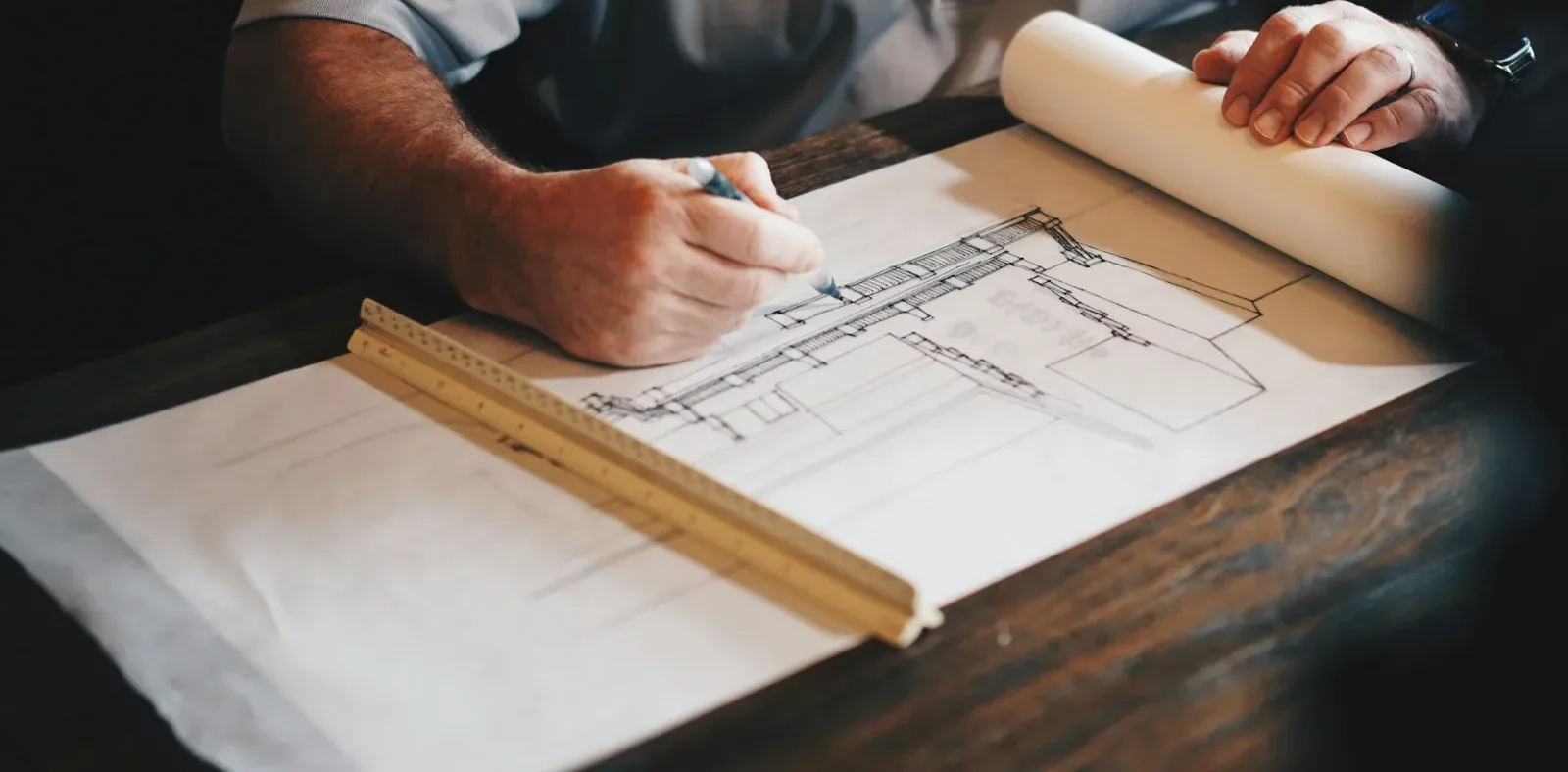 Quantity surveyor reviewing building plans